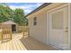 Backyard featuring a new wooden deck, siding and an outbuilding at 109 W Poplar St, Stanley, NC 28164