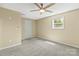 Bedroom featuring a ceiling fan, neutral paint, carpeted floors, and a window providing natural light at 109 W Poplar St, Stanley, NC 28164