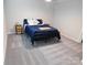 Cozy bedroom with carpet and a dark metal bed frame at 109 W Poplar St, Stanley, NC 28164
