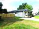 Newly renovated home boasts fresh siding, a new roof, and a charming front porch with green lawn at 109 W Poplar St, Stanley, NC 28164