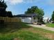 Newly renovated home boasts fresh siding, a new roof, and a charming front porch with green lawn at 109 W Poplar St, Stanley, NC 28164
