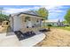 Inviting single-story home features a cozy front porch, neat landscaping, and a smooth walkway leading to the entrance at 109 W Poplar St, Stanley, NC 28164