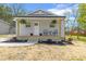 Charming single-story home with a welcoming front porch, complemented by tidy landscaping and a well-manicured lawn at 109 W Poplar St, Stanley, NC 28164