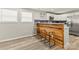 Open-concept living space with hardwood floors, natural light, and seamless connections to the kitchen at 109 W Poplar St, Stanley, NC 28164