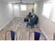 Bright living room features wood-look flooring, modern furnishings, and ample natural light at 109 W Poplar St, Stanley, NC 28164
