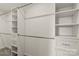 Bright walk-in closet with custom shelving and drawers, providing ample storage for clothes and accessories at 109 W Poplar St, Stanley, NC 28164