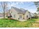 Relaxing backyard with a small patio, verdant lawn, and neutral color palette at 11539 Delores Ferguson Ln, Charlotte, NC 28277
