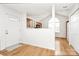 Entryway with hardwood floors, a view into the kitchen, and an arched window for natural light at 11539 Delores Ferguson Ln, Charlotte, NC 28277