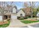 Attractive townhome boasts well-maintained lawn and easy access to Timothy Street at 11539 Delores Ferguson Ln, Charlotte, NC 28277