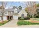 Well-maintained townhome featuring an attached garage, lush lawn and easy access to main street at 11539 Delores Ferguson Ln, Charlotte, NC 28277