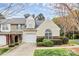Charming townhome featuring a one-car garage, manicured landscaping, and a welcoming facade at 11539 Delores Ferguson Ln, Charlotte, NC 28277