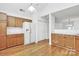 Bright eat-in kitchen features hardwood floors, ample cabinet space, and modern white appliances at 11539 Delores Ferguson Ln, Charlotte, NC 28277