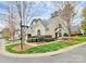 Street view of a charming community featuring well-maintained townhomes and landscaping on Timothy Street at 11539 Delores Ferguson Ln, Charlotte, NC 28277