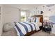 bedroom with space-themed wallpaper, a comfortable bed, and a cozy beanbag chair at 117 Vaquaro Dr, Mooresville, NC 28115