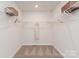 Walk-in closet with wire shelving and carpeted floor at 117 Vaquaro Dr, Mooresville, NC 28115