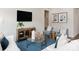 Bright living room features hardwood floors, stylish furniture, and a chic coffee table with tasteful decor at 117 Vaquaro Dr, Mooresville, NC 28115