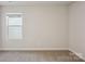 Serene bedroom featuring neutral carpeting, light walls, and a bright window at 121 Vaquaro Dr, Mooresville, NC 28115