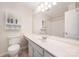 Spacious bathroom with built-in vanity and large mirror, cabinets, and a shower-tub combo at 1218 Green Oaks Ln # E, Charlotte, NC 28205