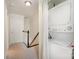 Bright hallway with staircase and closet with washer and dryer at 1218 Green Oaks Ln # E, Charlotte, NC 28205