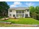 Wide backyard view of a home, showcasing the lawn and two-story exterior at 12531 Morning Creek Ln, Charlotte, NC 28214