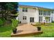 Backyard featuring a wooden deck, lawn, mature trees and the home's exterior at 12531 Morning Creek Ln, Charlotte, NC 28214