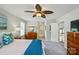 Bedroom with carpet, ceiling fan, and a blue blanket on the bed at 12531 Morning Creek Ln, Charlotte, NC 28214