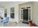 Close-up of the front door and porch, featuring a welcoming atmosphere and charming details at 12531 Morning Creek Ln, Charlotte, NC 28214
