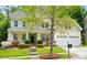 Charming two-story home with a well-manicured front yard, complemented by an attached two-car garage at 12531 Morning Creek Ln, Charlotte, NC 28214