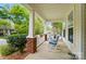 Inviting front porch with rocking chairs, offering a relaxing outdoor space at 12531 Morning Creek Ln, Charlotte, NC 28214