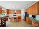 Well-equipped kitchen with an island, stainless steel appliances, and adjacent workstation at 12531 Morning Creek Ln, Charlotte, NC 28214
