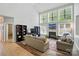 Spacious living room with high ceiling, fireplace, and large windows for lots of natural light at 12531 Morning Creek Ln, Charlotte, NC 28214