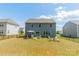 Expansive backyard with outdoor seating areas and a large lawn, perfect for entertaining and relaxing at 127 Slip Shot Ln, Troutman, NC 28166