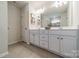 Bright bathroom with double vanity, ample counter space, and a view into the shower at 127 Slip Shot Ln, Troutman, NC 28166