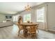 Well-lit dining area with wood table, comfortable chairs, and open access to the living room at 127 Slip Shot Ln, Troutman, NC 28166