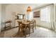 Dining room featuring a wooden table, natural light, and decorative accents at 127 Slip Shot Ln, Troutman, NC 28166