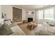 Comfortable living room featuring stylish decor, a fireplace, and lots of natural light at 127 Slip Shot Ln, Troutman, NC 28166