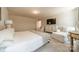 Bright main bedroom with plenty of space, dresser with TV, and comfortable seating areas at 127 Slip Shot Ln, Troutman, NC 28166