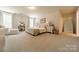 Bright main bedroom with a cozy sitting area, natural light, and tasteful decor at 127 Slip Shot Ln, Troutman, NC 28166