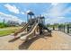 Community playground with slides and climbing structure, perfect for Gathering fun on a sunny day at 127 Slip Shot Ln, Troutman, NC 28166
