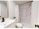 Bright bathroom featuring a white vanity, toilet, and shower, with neutral paint and modern fixtures at 1274 Oakbrook Ln, Denver, NC 28037