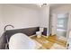 A modern bathroom featuring a freestanding tub, wainscoting, and wood floors at 1274 Oakbrook Ln, Denver, NC 28037