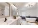 Updated primary bathroom featuring double sinks, framed mirrors, and a modern soaking tub at 1274 Oakbrook Ln, Denver, NC 28037