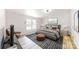 Beautiful bedroom with hardwood floors, a gray accent rug, and a relaxing seating area at 1274 Oakbrook Ln, Denver, NC 28037