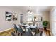 Bright dining room featuring modern lighting and dining table with seating for six at 1274 Oakbrook Ln, Denver, NC 28037
