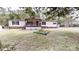 Charming single story home featuring a welcoming porch, black shutters, and manicured front lawn at 1274 Oakbrook Ln, Denver, NC 28037