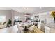 Bright kitchen features stainless steel appliances, white cabinets, and an adjacent dining area at 1274 Oakbrook Ln, Denver, NC 28037