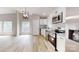 Bright kitchen features stainless steel appliances, granite countertops, and light colored wood flooring at 1274 Oakbrook Ln, Denver, NC 28037
