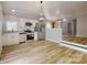 Modern kitchen with stainless steel appliances, granite countertops, and open layout to dining area at 1274 Oakbrook Ln, Denver, NC 28037