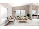 Bright living room featuring large windows, hardwood floors, and neutral décor at 1274 Oakbrook Ln, Denver, NC 28037