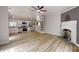 Open concept living space connecting the kitchen, dining, and living areas with lots of light at 1274 Oakbrook Ln, Denver, NC 28037